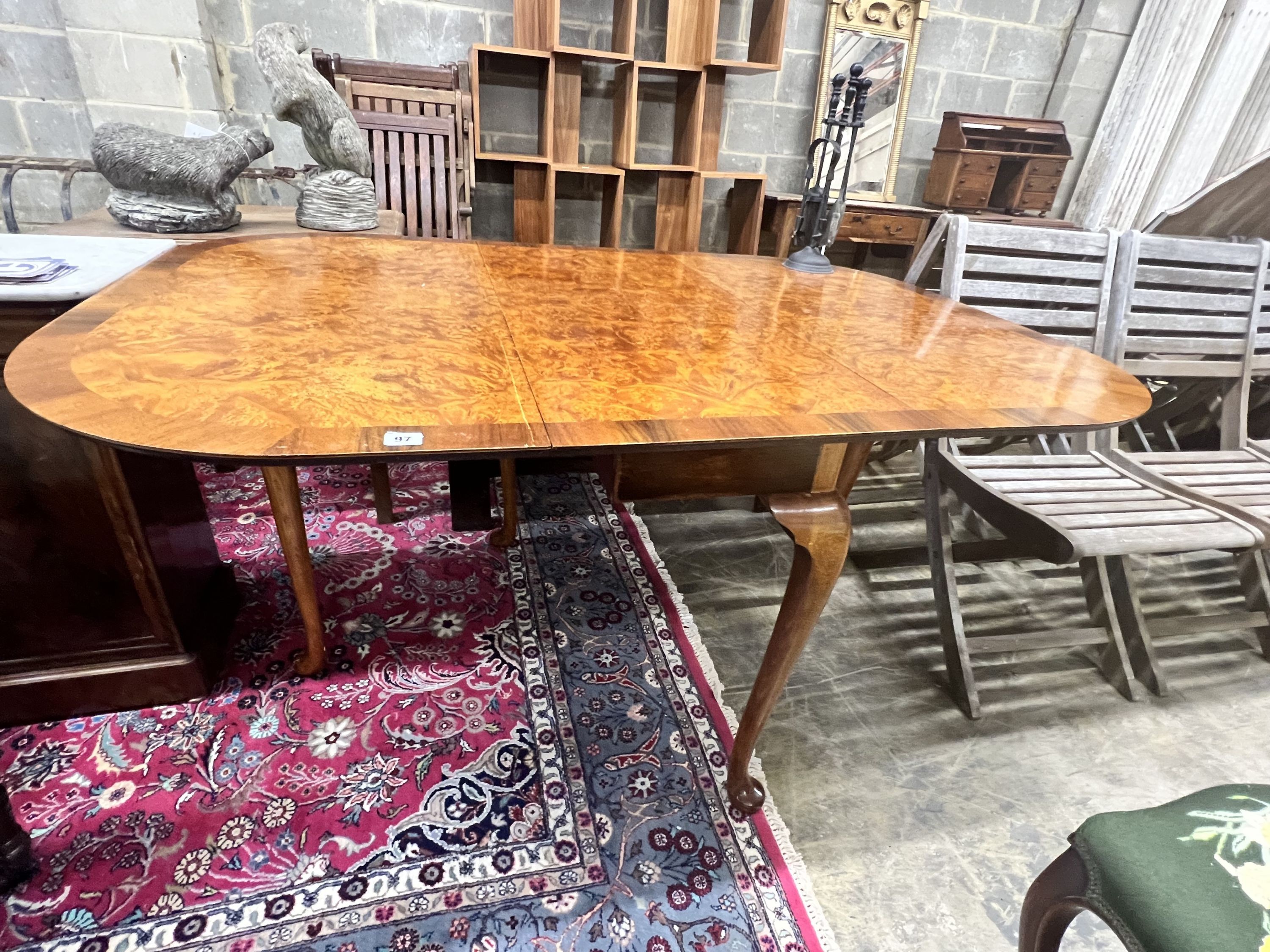 A Queen Anne Walnut revival burr walnut pad foot drop leaf dining table, extended 144cm wdith 99cm height 74cm
